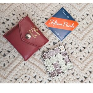 ThinkFun Fifteen Puzzle Classic Sliding Tile Game Metal Enamel with Red Case